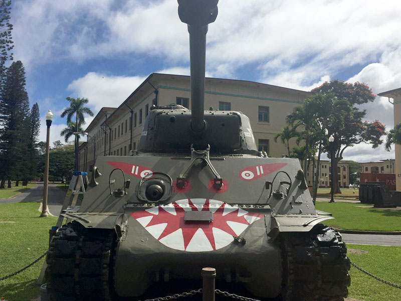 US Army tank outside museum on grass.